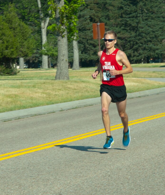York Thomas, Nebraska resident, nears the finish line of F.E. Warren Air Force Base’s Buffalo Stampede 5K race July 19, 2014, near the Argonne Parade Field. Thomas finished first in the 5K, and his wife, Megan Zavorka Thomas, finished first in the 10K race. (U.S. Air Force photo by Airman 1st Class Jason Wiese)