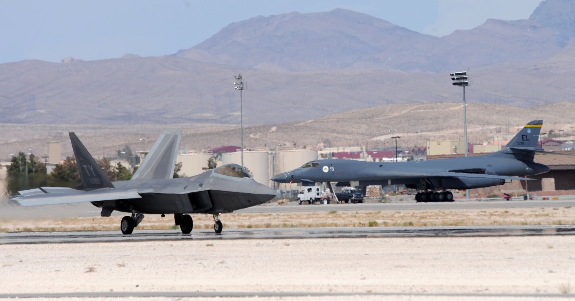 An F-22 Raptor, assigned to the 325th Fighter Wing, Tyndall Air Force Base, Florida, lands after a training exercise during Red Flag 14-3 on Nellis AFB, Nev., July 15, 2014. Red Flag is a combat training exercise scheduled to run July 14 to 25, with the 28th Bomb Wing out of Ellsworth AFB, S.D., as the lead wing. (U.S. Air Force photo by Tech. Sgt. Jerry Fleshman/Released)