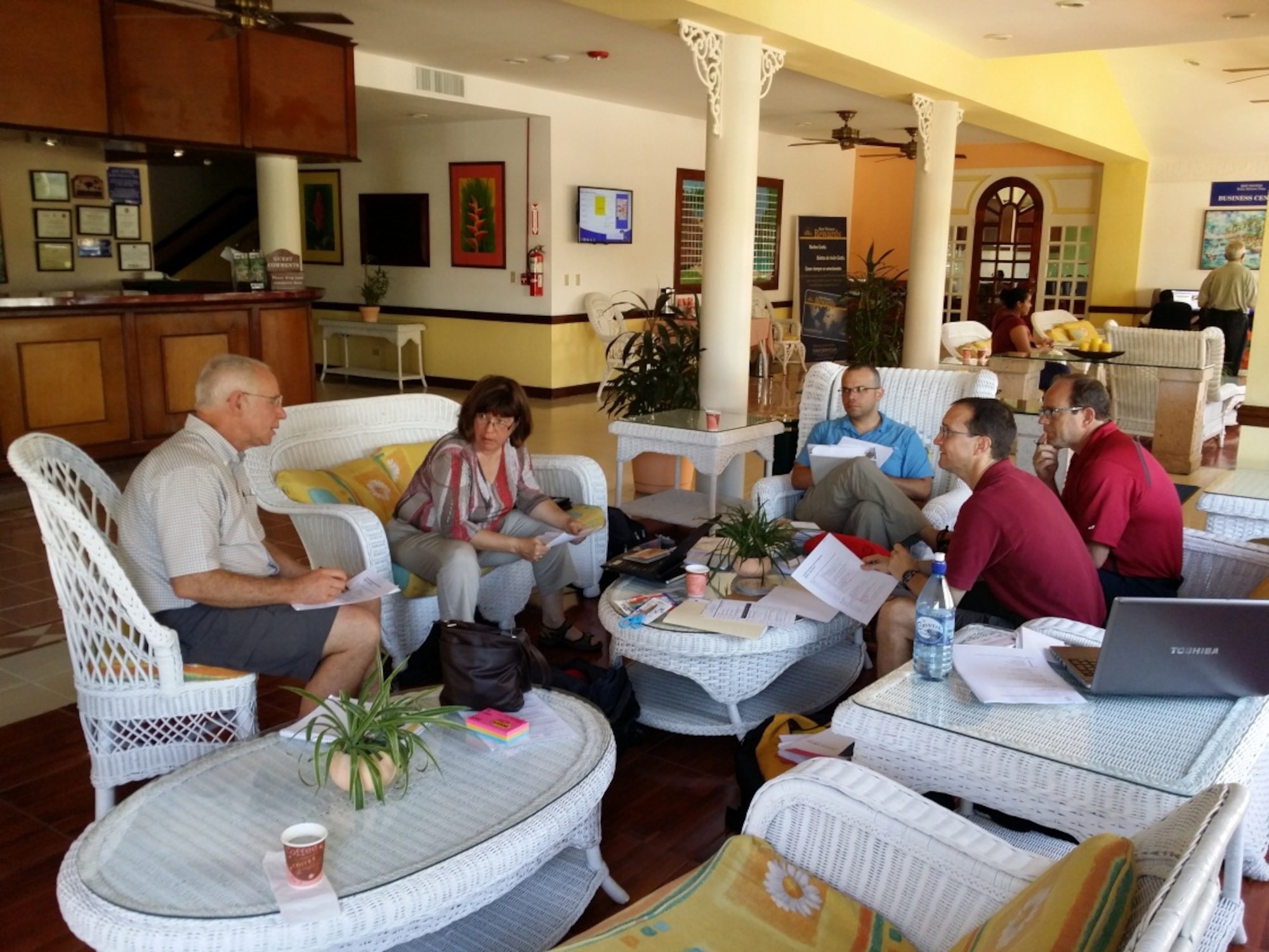 Dr. Robert Persons, Dr. Lesley Atwood, Dr. Ricardo Sequeira, Dr. Gerry Prince and Dr. Lyrad Riley discuss the agenda for the Global ALSO Instructor Course in Belize City, Belize, July 21, 2014.  (Courtesy Photo)
