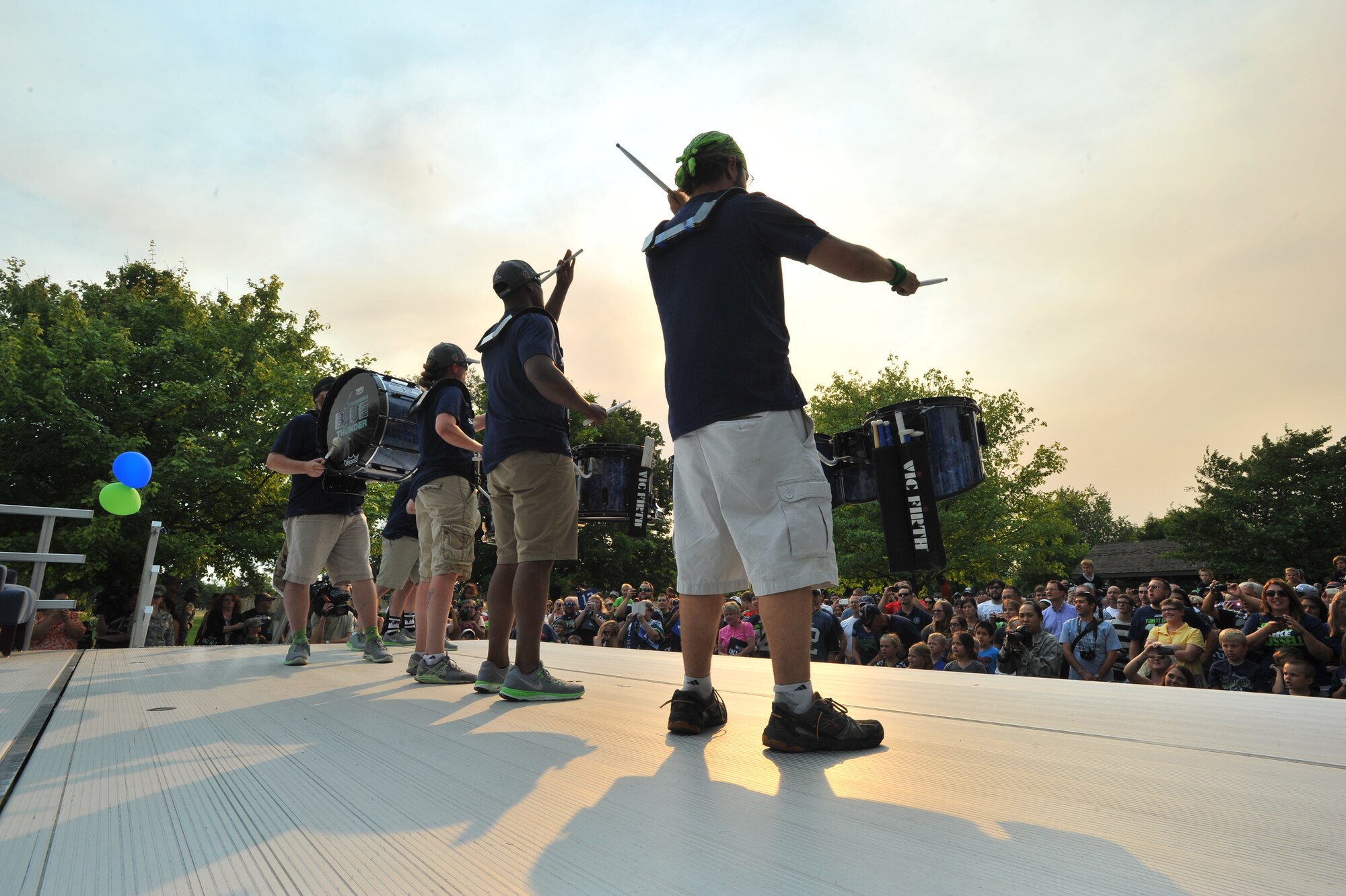 Members of the Blue Thunder band from the Seattle Seahawks perform for fans July 18, 2014, at Fairchild Air Force Base, Wash.  The Superbowl champions were here as part of their “Heroes of 12” tour.  (U.S. Air Force photo by Staff Sgt. Veronica Montes/Released)