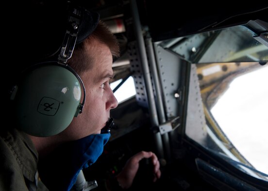 Senior Airman Michael Weidman, a boom operator assigned to the 93rd Air Refueling Squadron, Fairchild Air Force Base, Wash., maneuvers the boom of a KC-135 Stratotanker into place to refuel aircraft participating in Red Flag 14-3, July 17, 2014, over the Nevada Test and Training Range. In addition to providing fuel for aircraft in mid-air, the KC-135 can carry up to 83,000 pounds of cargo. (U.S. Air Force photo by Airman 1st Class Thomas Spangler)