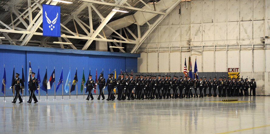 Airmen from the U.S. Air Force Honor Guard march into place during the Air Force District of Washington change of command ceremony at Joint Base Andrews, Maryland, July 22, 2014. During the ceremony Maj. Gen. Darryl W. Burke assumed command of AFDW from Maj. Gen. Sharon K. G. Dunbar. (U.S. Air Force photo/Master Sgt. Tammie Moore)