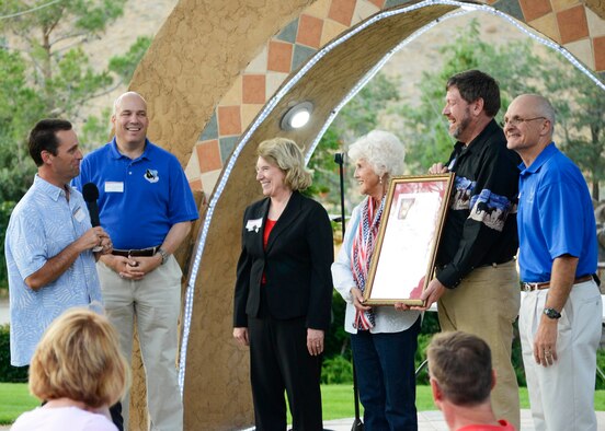 California State Senator Steve Knight (left) was joined by Brig. Gen. Michael Brewer, 412th Test Wing commander, to his left and Maj. Gen. Arnold Bunch, Air Force Test Center commander (far right), to present Civ-Mil founder Aida O’Connor with a resolution, recognizing the work that Civ-Mil has done and continues to do for Edwards AFB. (U.S. Air Force photo by Rebecca Amber) 
