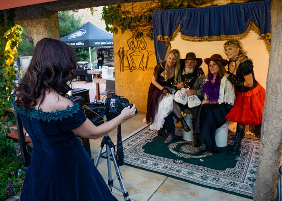 Guests were invited to dress up in old time clothing at the Spoiled Doves of California and Texas photo booth where they received a free souvenir photo at the annual Edwards Civilian-Military Group barbeque. (U.S. Air Force photo by Rebecca Amber)