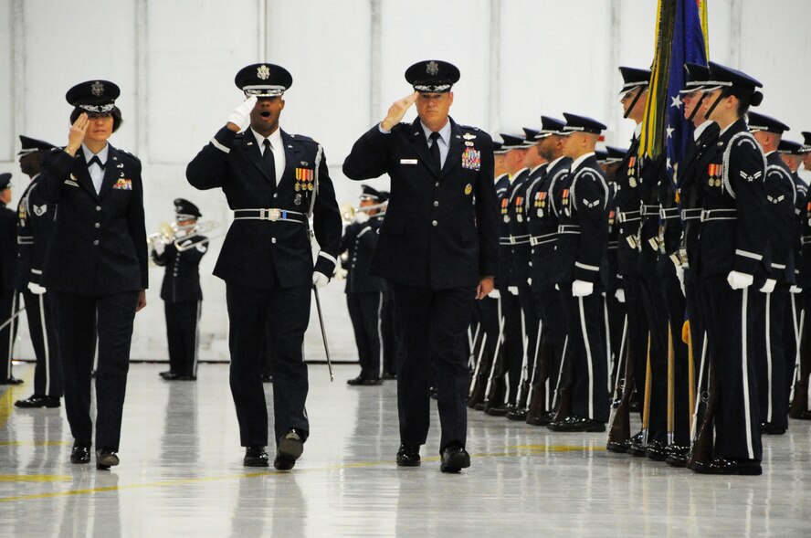 Maj. Gen. Sharon K. G. Dunbar and Maj. Gen. Darryl W. Burke review the U.S. Air Force Honor Guard during the Air Force District of Washington change of command ceremony on Joint Base Andrews, Maryland, July 22, 2014. Burke, Commander of AFDW, assumed command from Dunbar during the ceremony. (U.S. Air Force photo/Staff Sgt. Matt Davis)