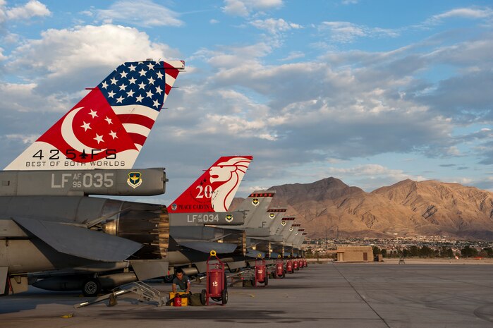 A Singapore air force aircraft maintainer begins preparations for night operations during Red Flag 14-3, July 16, 2014, at Nellis Air Force Base, Nev. Red Flag provides air and ground crews from various units, air frames, branches, and allied nations the chance to work together and practice combat operations. (U.S. Air Force photo by Airman 1st Class Thomas Spangler)