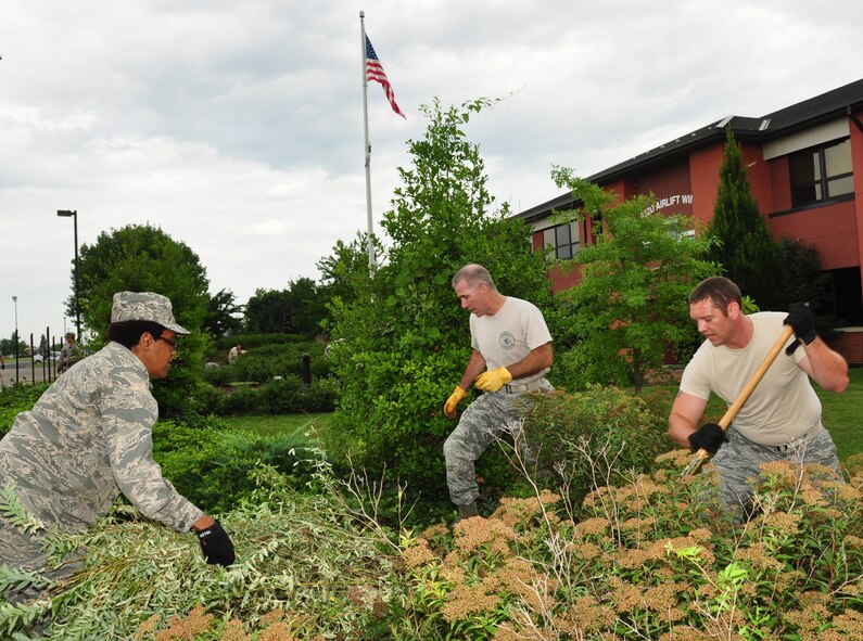 932nd Airlift Wing members joined together to work on a self-help project cleaning the grounds in front of the wing headquarters building during the unit training assembly.  A large amount of material was cleaned up and the results were quite positive as seen by many visitors when walking by the flagpole.  (U.S. Air Force photo/Staff Sgt. Amber Hodges)
