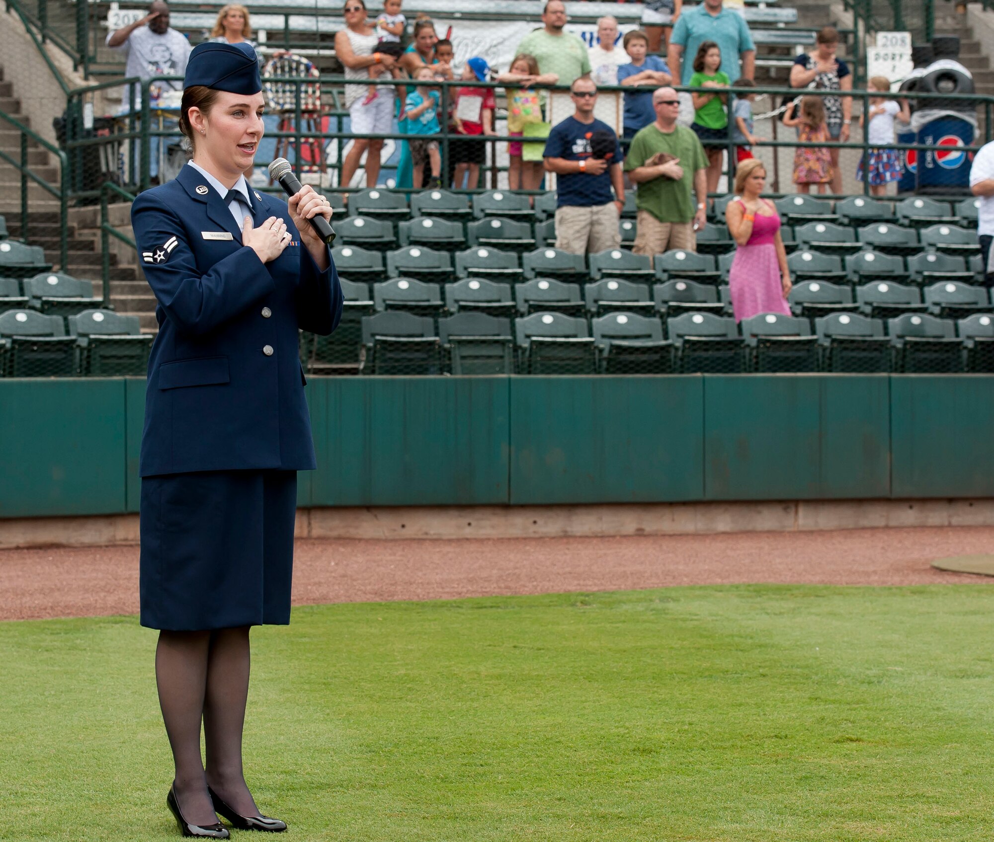 Airman 1st Class Sydney Manning, 628th Air Base Wing Public Affairs broadcaster, sings the National Anthem during Military Appreciation Night July 13, 2013, at Joseph P. Riley Jr. ballpark in Charleston, S.C. Manning performed for more than 5,000 attendees at the Charleston RiverDogs hosted Military Appreciation Night. (U.S. Air Force photo/ Staff Sgt. William A. O’Brien)