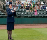 Airman 1st Class Sydney Manning, 628th Air Base Wing Public Affairs broadcaster, sings the National Anthem during Military Appreciation Night July 13, 2013, at Joseph P. Riley Jr. ballpark in Charleston, S.C. Manning performed for more than 5,000 attendees at the Charleston RiverDogs hosted Military Appreciation Night. (U.S. Air Force photo/ Staff Sgt. William A. O’Brien)
