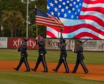 Joint Base Charleston Honor Guard posts the colors for Military Appreciation night at the Charleston RiverDogs game Aug. 21, 2013, at Joseph P. Riley Jr. ballpark in Charleston, S.C. The Charleston RiverDogs hosted Military Appreciation Night to show their support for the local military. (U.S. Air Force photo/ Staff Sgt. William A. O’Brien)