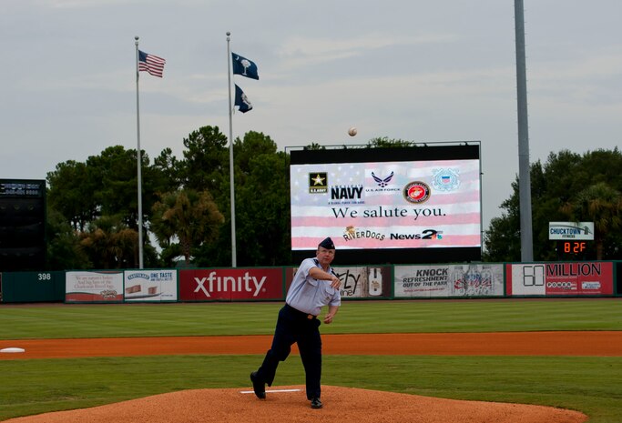 Col. Jeffrey DeVore, Joint Base Charleston commander, delivers the ceremonial first pitch during Military Appreciation Night July 19, 2014, at Joseph P. Riley Jr. ballpark in Charleston, S.C. The Charleston RiverDogs hosted Military Appreciation Night to show their support for the local military. (U.S. Air Force photo/ Staff Sgt. William A. O’Brien)