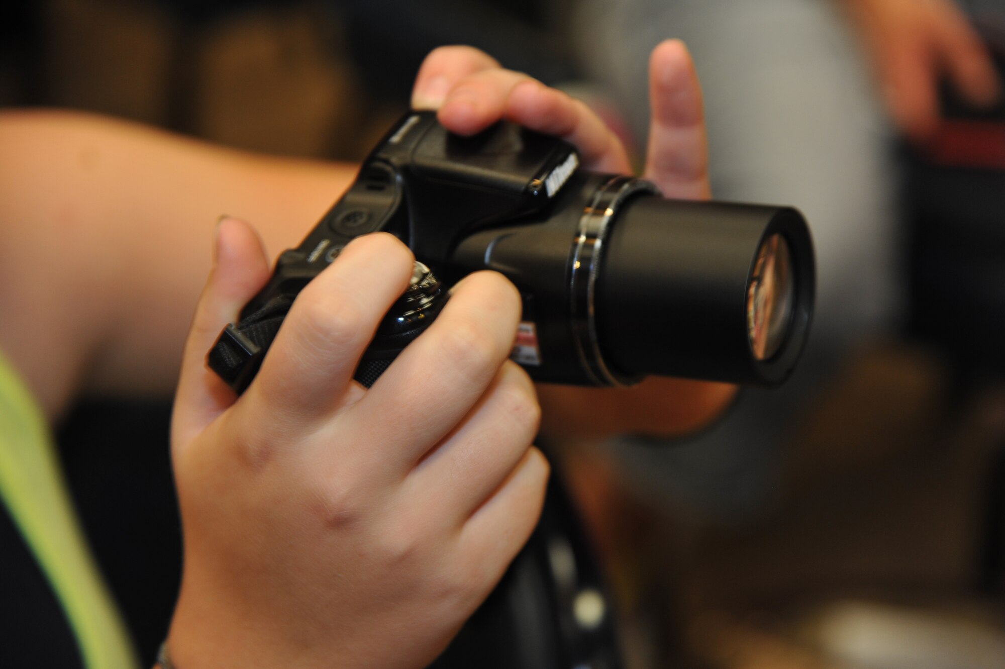 ALTUS AIR FORCE BASE, Okla. – A student takes a photo during the free photography class June 18, 2014. This portrait class was a part of the free photography series U.S. Air Force Master Sgt. Jaime Garcia, 97th Communications Squadron network control center section chief, is teaching throughout the year. (U.S. Air Force photo by Airman 1st Class J. Zuriel Lee/Released)