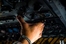 U.S. Air Force Master Sgt. Vincent Bartolmain, 737th Expeditionary Airlift Squadron flight engineer, turns a dial on an instrument panel inside a C-130H Hercules July 20, 2014 at an undisclosed location in Southwest Asia. Bartolmain deployed here from the 910th Airlift Wing, Youngstown Air Reserve Station, Ohio in support of Operation Enduring Freedom. (U.S. Air Force photo by Staff Sgt. Jeremy Bowcock)