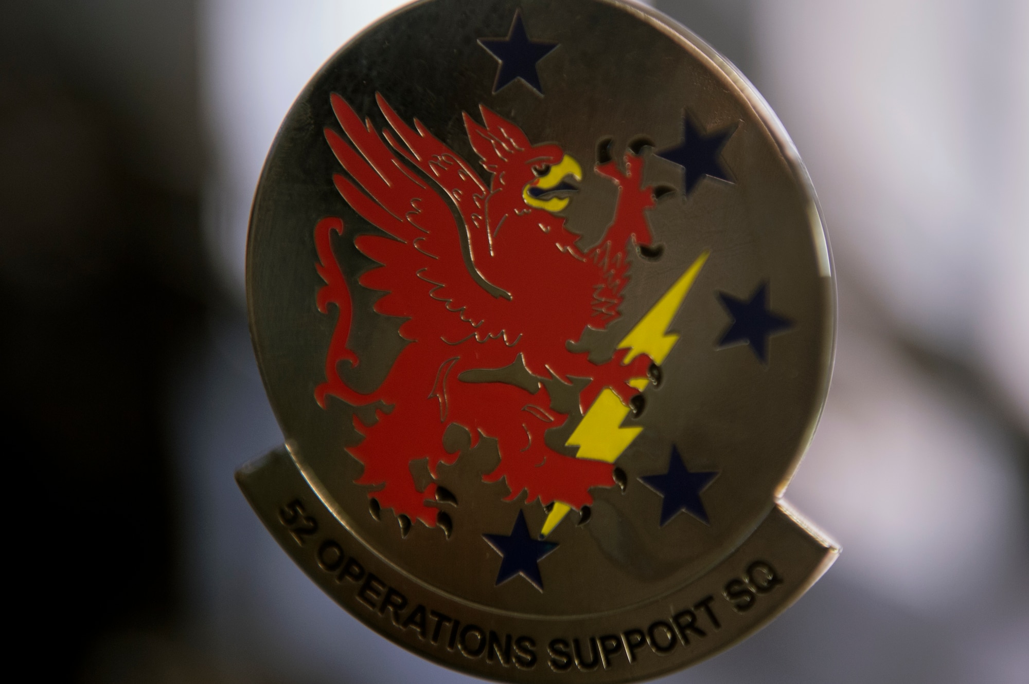A trinket with the 52nd Operations Support Squadron emblem is displayed inside the air crew flight equipment shop July 15, 2014, at Spangdahlem Air Base, Germany. The 52nd OSS was constituted on Jan. 25, 1943, and activated on Feb. 1, 1943, in support of World War II. (U.S. Air Force photo by Senior Airman Rusty Frank/Released)