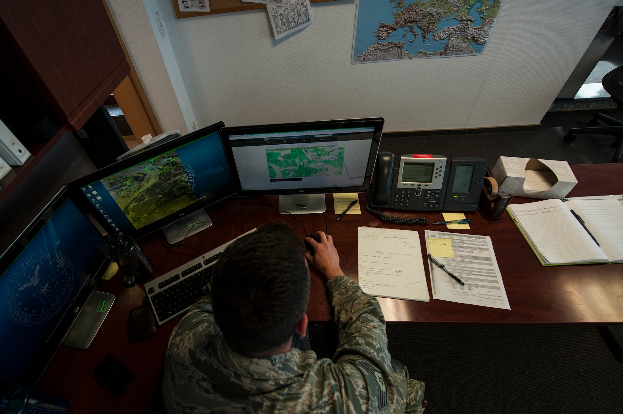 U.S. Air Force Staff Sgt. Michael Nelson, 52nd Operations Support Squadron NCO in charge of mission weather element from Kingsville, Texas, participates in a meteorological conference July 15, 2014, at Spangdahlem Air Base, Germany. Members of the weather flight hold the conference two or three times a week to keep their members aware of the weather forecast. (U.S. Air Force photo by Senior Airman Rusty Frank/Released)