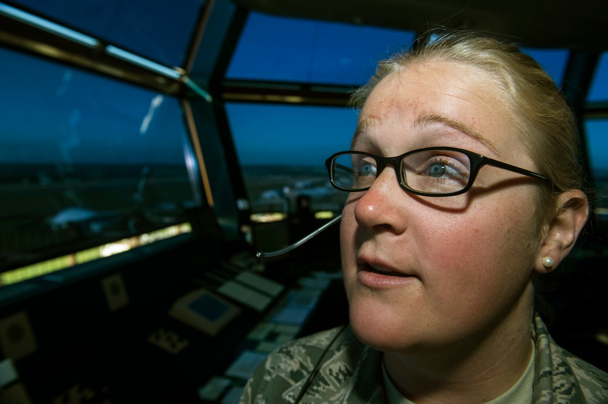 U.S. Air Force Staff Sgt. Nelson Monica, a 52nd Operations Support Squadron control tower watch supervisor from Washburn, Wis., maintains situational awareness around the airfield July 14, 2014, at Spangdahlem Air Base, Germany. The control tower falls under the Airfield Operations Flight which controls all airfield and air traffic activities. (U.S. Air Force photo by Senior Airman Rusty Frank/Released)