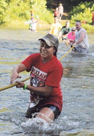 Addy Falaniko makes her way across the Big Piney River during the Marine Corps Detachment’s 10k Volkslauf mud run. More than 1,200 people turned out for the event.
