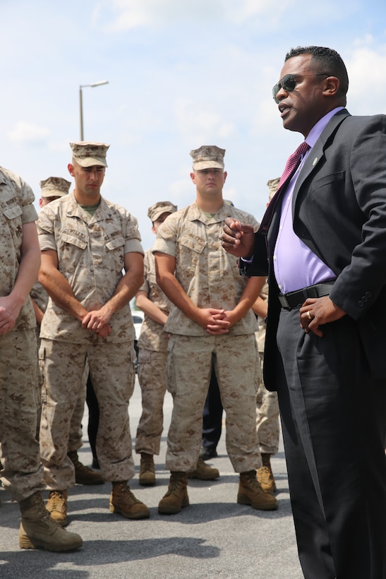 Maceo Frank talks to a group of Marines and military police officers following a ceremony recognizing the Marine Corps Air Station Cherry Point Provost Marshal's Office for earning federal accreditation at the air station July 17, 2014. Frank is the Law Enforcement Academy East Director with Headquarters Marine Corps' Plans, Policies and Operations Law Enforcement and Corrections Branch.



