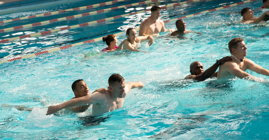 Participants practice some of the exercise fundamentals learned during the Physical Trainers Coordinators Course held by Semper Fit at the Area 2 Pool aboard Marine Corps Base Camp Lejeune, May 12. The course was intended to provide physical trainers with the knowledge they need to be effective fitness leaders.  (Official U.S. Marine Corps photo by Cpl. Jackeline Perez Rivera/Released)


