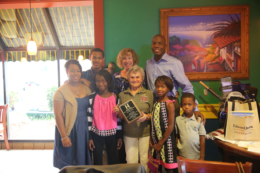 Gunnery Sergeant Otis James and his family stand with Havelock Military Affairs Committee representatives after being recognized as the Family of the Quarter at a ceremonial dinner at El Cerro Mexican Bar and Grill in Havelock, N.C., July 22, 2014. James and his wife, Lytasha, dedicate themselves to volunteering with the Girl Scouts of America, Havelock t-ball and local schools. James is currently serving as the company gunnery sergeant and operations chief with Combat Logistics Company 21 at Marine Corps Air Station Cherry Point, while Lytasha works as a stay-at-home mother and full-time college student.


