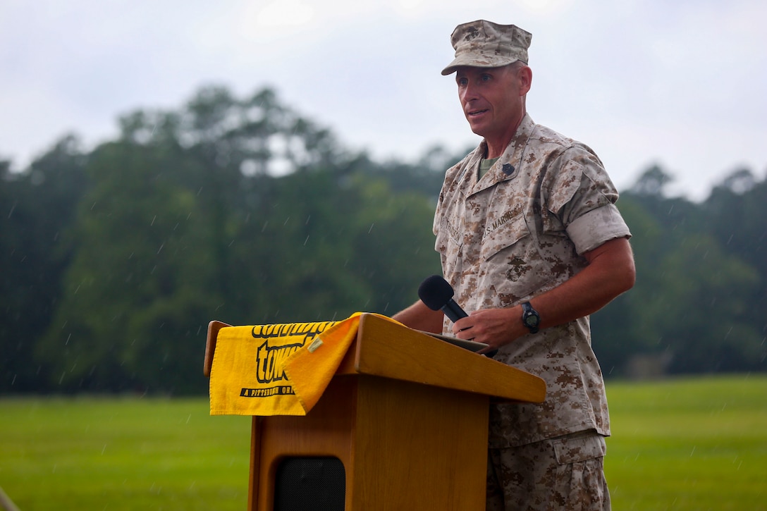 Sgt. Maj. Scott L. Theakston thanks family and friends for continued support throughout his career during the School of Infantry - East relief and appointment ceremony and retirement ceremony at Camp Geiger aboard Marine Corps Base Camp Lejeune, June 27. Theakston retired from the Marine Corps after 30 years of service, handing over his position to Sgt. Maj. Robert H. Brown Jr.  (Official U.S. Marine Corps photo by Lance Cpl. Jared Lingafelt/Released)


