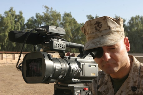 On 30 September 2006, Staff Sergeant Benjamin E. Barr, a Combat Videographer with I Marine Expeditionary Force Combat Camera, documents a graduation ceremony for new Iraqi Soldiers of Basic Training Class 4 (BTC-4) on Camp Habaniyah, Iraq.

Regimental Combat Team 5 is deployed with I Marine Expeditionary Force in support of Operation Freedom in the Al Anbar Province of Iraq (Multi-National Forces-West) to develop the Iraqi Security Forces, facilitate the development of official rule of law through democratic government reforms, and continue the development of a market based economy centered on Iraqi Reconstruction. (U.S. Marine Corps photo by Sgt Adaecus G. Brooks) (RELEASED)