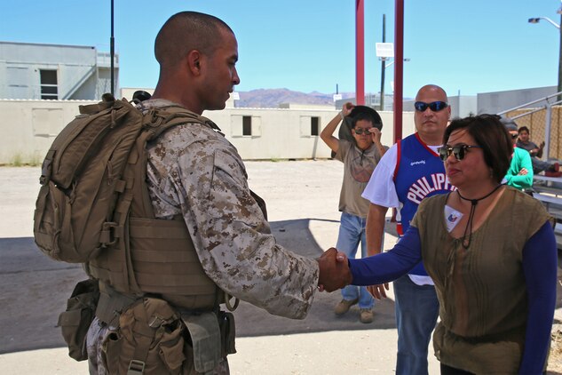 Ruby Santos, right, a role-player, meets 1st Lt. Nikolas Gillespie, left, survey team officer-in-charge with Combat Logistics Battalion 15, Headquarters Regiment, 1st Marine Logistics Group, while functioning as a mayor for an area in need of humanitarian assistance as part of CLB-15’s pre-deployment training with the Special Operations Training Group, 1st Marine Expeditionary Force, aboard Camp Pendleton, Calif., July 16, 2014. The exercise took place over the course of three days and provided CLB-15 with a realistic and immersive experience. The fog of war, language barriers and logistical issues were 
just a few of the problems the Marines and sailors faced. CLB-15 is slated to deploy with the 15th Marine Expeditionary Unit, 1st Marine Expeditionary Force. 