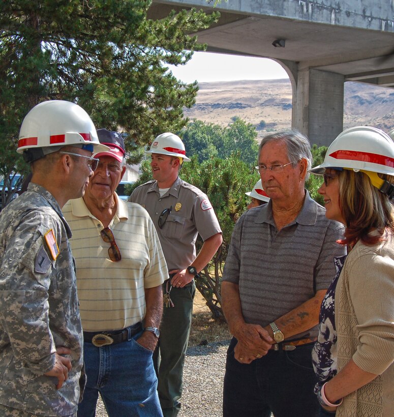 Portland District Commander, Col. Jose L. Aguilar, and The Dalles Lock and Dam Administrative Officer, Tamera Armstrong, talk with two former employees of The Dalles Lock and Dam. Dean Webster and Aaron Hagaman were part of the concrete construction of the dam, building it strong from the ground up. The Dalles Lock and Dam was named a National Historic Civil Engineering Landmark.