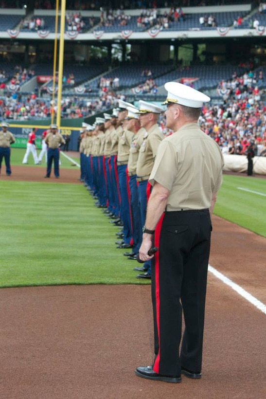 Major General John J. Broadmeadow, Commanding General, Marine Corps Logistics Command, gets ready to address the crowd at Turner Field on 19 July, 2014, as The Atlanta Braves celebrated the United States Marine Corps on Marine Corps Appreciation Day.  More than 60 Marines march onto Turner Field in Atlanta, Georgia, during the Marine Corps Appreciation Day game.  In attendance was Medal of Honor Recipient, Kyle Carpenter whom Broadmeadow gave a special tribute to. Broadmeadow thanked all service members for their dedication and duty to this great country before throwing out the first pitch of the night.