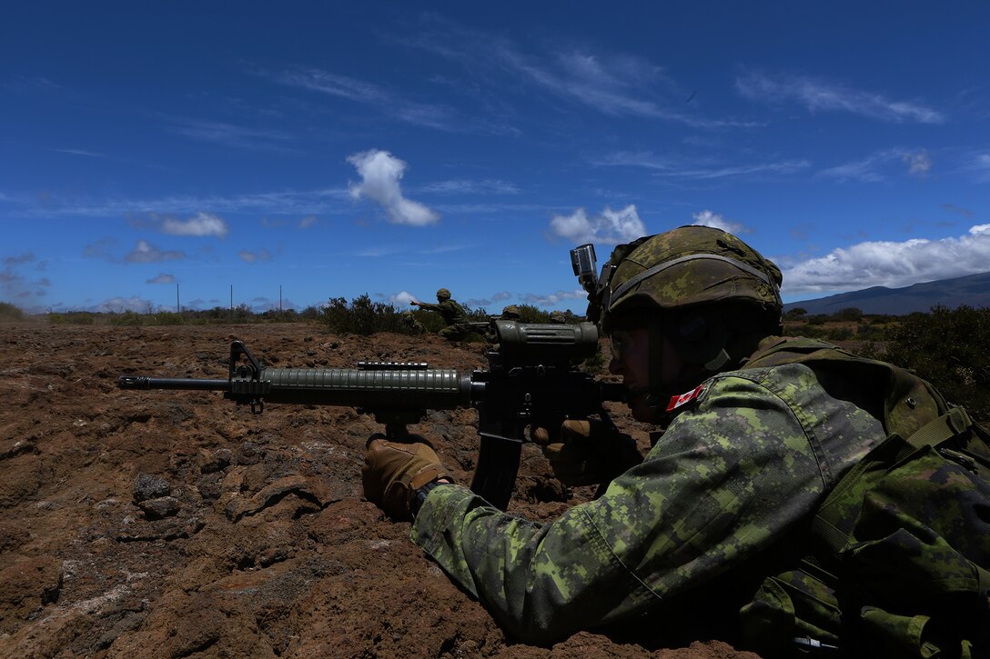 POHAKULOA TRAINING AREA, Hawaii - A soldier with Princess Patricia's Canadian Light Infantry fires off his weapon at a target during a live fire shoot, as part of Rim of the Pacific (RIMPAC) Exercise 2014, July 18. Twenty-two nations, more than 40 ships and submarines, about 200 aircraft and 25,000 personnel are participating in RIMPAC from June 26 to Aug. 1 in and around the Hawaiian Islands and Southern California. The world's largest international maritime exercise, RIMPAC provides a unique training opportunity that helps participants foster and sustain the cooperative relationships that are critical to ensuring the safety of sea lanes and security on the world's oceans. RIMPAC 2014 is the 24th exercise in the series that began in 1971. (U.S. Marine Corps photo by Cpl. Erik Estrada/Released)