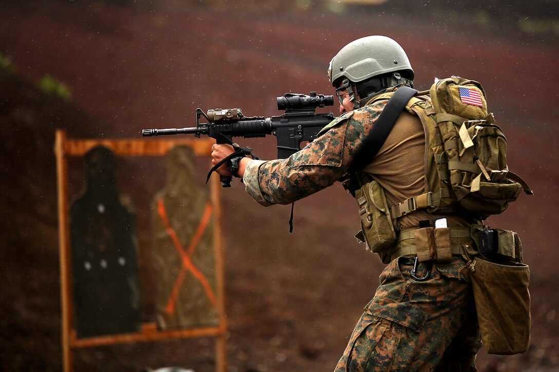 POHAKULOA TRAINING AREA, Hawaii – A U.S. Marine assigned to third  platoon, Alpha Company, 3d Reconnaissance Battalion, fires rounds from his M4 service rifle during lateral movement shooting on Range 8, Pohakuloa Training Area, Hawaii during Rim of the Pacific (RIMPAC) Exercise 2014, July 19. Twenty-two nations, 49 ships and six submarines, more than 200 aircraft and 25,000 personnel are participating in RIMPAC from June 26 to Aug. 1 in and around the Hawaiian Islands and Southern California. The world's largest international maritime exercise, RIMPAC provides a unique training opportunity that helps participants foster and sustain the cooperative relationships that are critical to ensuring the safety of sea lanes and security on the world's oceans. RIMPAC 2014 is the 24th exercise in the series that began in 1971. (U.S. Marine Corps photo by Cpl. Matthew Callahan/Released)
