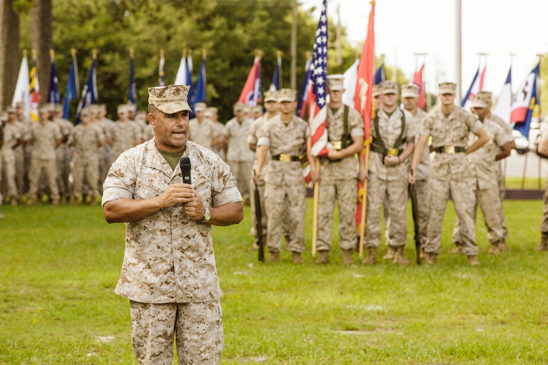 Lt. Col. Carlos A. Vallejo addresses the audience after relinquishing command of Weapons Training Battalion during the battalion change of command ceremony at Stone Bay aboard Marine Corps Base Camp Lejeune, July 2. He was replaced by Lt. Col. Mark R. Reid. (Official U.S. Marine Corps photo by Lance Cpl. Justin A. Rodriguez/Released