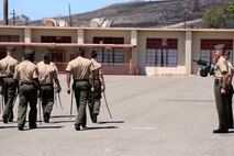 Marines with 11th Marine Regiment march past Col. Christopher A. Tavuchis and Col. Stephen Liszewski, during a pass and review portion of the regimental change of command ceremony aboard Marine Corps Base Camp Pendleton, Calif., July 22, 2014. During the ceremony Tavuchis assumed command of 11th Marines from Lizsewski. (U.S. Marine Corps photo by Lance Cpl. David Silvano/released)