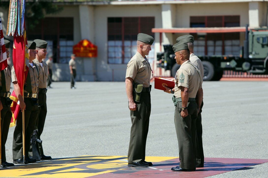 Brigadier General Carl E. Mundy, III, deputy commanding general of I Marine Expeditionary Force, awards the Legion of Merit to Col. Stephen Liszewski, the former commanding officer of 11th Marine Regiment during the 11th Marines change of command ceremony aboard Marine Corps Base Camp Pendleton, Calif., July 22, 2014. Liszewski relinquished command as commanding officer and was awarded the Legion of Merit. (U.S. Marine Corps photo by Lance Cpl. David Silvano/released)