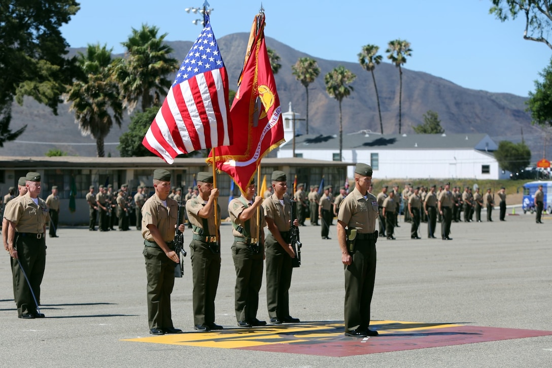 Colonel Stephen Liszewski, from Gaithersburg, Md., and the former commanding officer of 11th Marine Regiment, stands in front of the colors during the regimental change of command ceremony aboard Marine Corps Base Camp Pendleton, Calif., July 22, 2014. Liszewski relinquished command as commanding officer and was awarded the Legion of Merit. (U.S. Marine Corps photo by Lance Cpl. David Silvano/released)