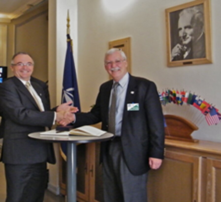 Signing the visitor book at NATO-CSO, left to right: René LaRose, Director NATO Collaboration Support Office and Dr. Russell Harmon, Director ERDC International Research Office.