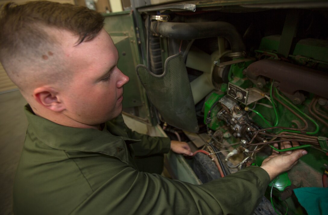 Lance Cpl. Gus O’Brien, an engineer equipment electrical systems technician, or generator mechanic, with Combat Logistics Company 11, Combat Logistics Regiment 15, disassembles a generator while taking out a broken fuel injector aboard Marine Corps Air Station Miramar, Calif., July 22. O’Brien is part of a third-echelon repair shop, meaning he repairs generators other units cannot repair themselves due to restrictions in the technical manual.