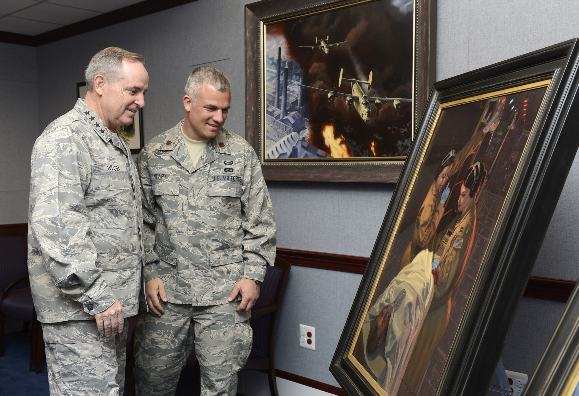 Air Force Chief of Staff Gen. Mark A. Welsh III looks at the painting, "Bandage 33," June 20, 2014, with the artist, Maj. Warren Neary, in the Pentagon. Neary, a U.S. Air Force Reserve historian, contributed "Bandage 33" and another work, titled "Showtime," through the Air Force Art Program. (U.S. Air Force photo/Scott M. Ash)
