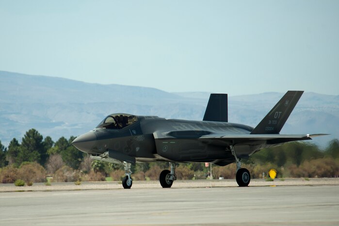 An F-35A Lightning II assigned to the 59th Test and Evaluation Squadron, taxis in after landing July 18, 2014, at Nellis Air Force Base, Nev. This marked the first F-35 flight at Nellis to take place since the fleet was grounded after a runway fire took place at Eglin AF B, Fla., June 23. While grounded, additional inspections of the fleet’s engines were conducted to insure the safety of pilots and aircrew.  (U.S. Air Force photo by Senior Airman Timothy Young)