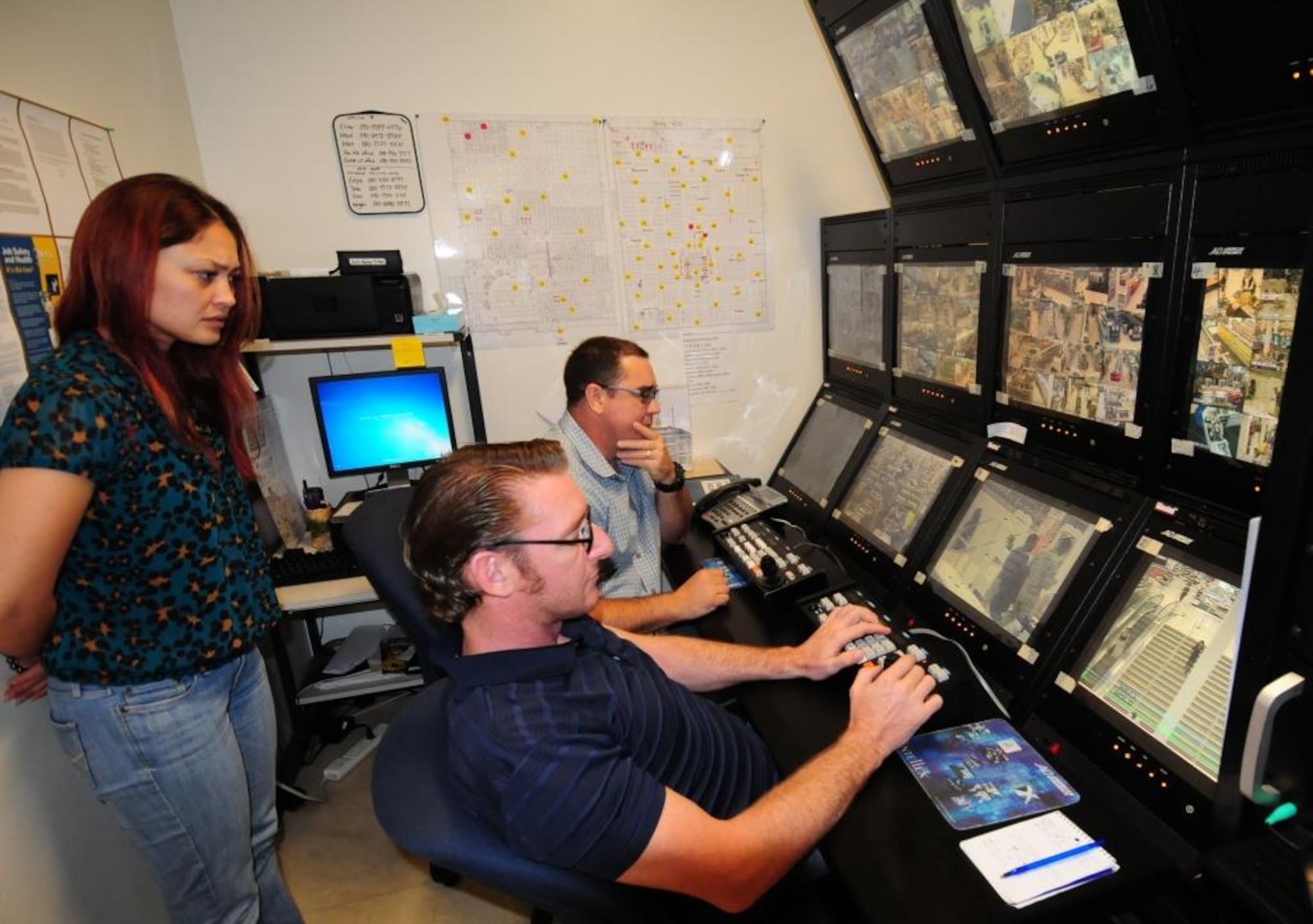 Elina Bennet, assistant loss prevention manager and Jeff Heitchler and John
Keith of the Exchange Safety and Security Force, observe store shoppers
before calling the floor manager to report suspicious activity at the Kadena
Air Base Exchange on Okinawa, Japan, June 30, 2014. Andersen Air Force
Base's Exchange Loss Prevention program is regionally located on the island
of Okinawa. (Courtesy photo by Staff Sgt. Robert DeDeaux/Released)
