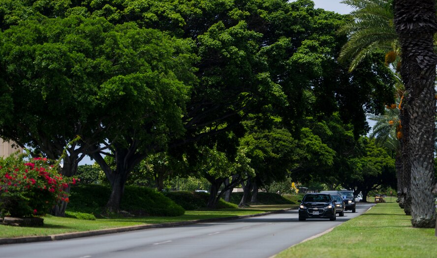 A convoy of vehicles transport the remains of Col. Eugene Smith from the Joint POW/MIA Accounting Command facility on Joint Base Pearl Harbor-Hickam, Hawaii July 22, 2014. While flying to Elmendorf Air Force Base in November 1952, Smith was lost when his Douglas C-124 Globemaster II crashed into the side of Mt. Gannet in Alaska. The lost crash site was recently found by the Alaska Air National Guard. Smith will be brougt home to Delaware via military dignified transfer July 24, 2014 and will recieve a burial with full military honors. (U.S. Air Force photo by Staff Sgt. Nathan Allen/Released)