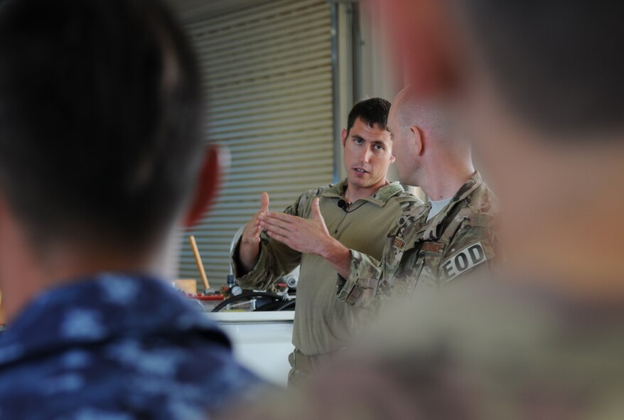 U.S. Air Force Tech. Sgt. Ryan Manzi, 35th Civil Engineer Squadron explosive ordnance disposal craftsman, conducts a safety briefing before the start of a joint, bilateral exercise at the Draughon Bombing Range, Misawa Air Base, Japan, July 15, 2014. Manzi also explained the procedures for what would be going on at the range. (U.S. Air Force photo/Senior Airman Jose L. Hernandez-Domitilo)
