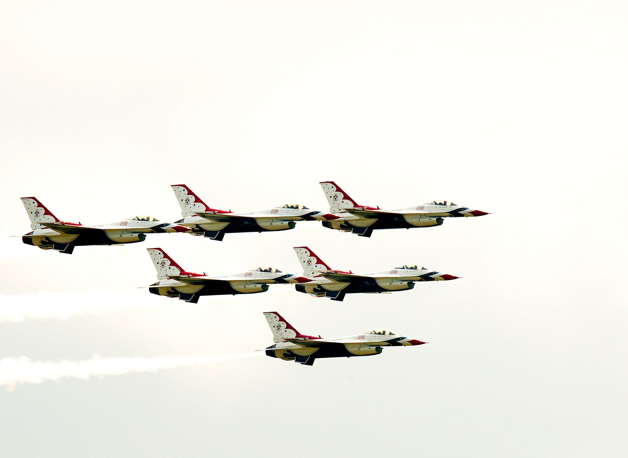140723-F-JW079-487 The U.S. Air Force Thunderbirds streak across the sky in the delta formation as part of the 118th Cheyenne Frontier Days July 23 in Cheyenne, Wyo. Despite cloudy skies, the aerial team performed many aerial maneuvers. (U.S. Air Force photo by R.J. Oriez)
