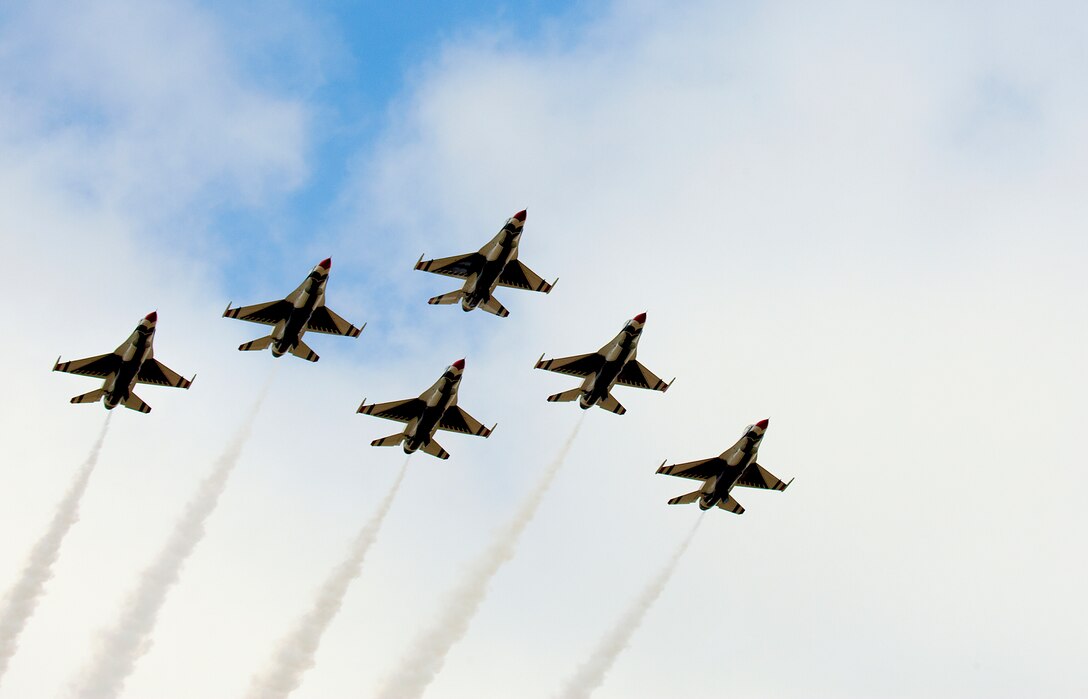 140723-F-JW079-185 The U.S. Air Force Thunderbirds streak across the sky in the delta formation as part of the 118th Cheyenne Frontier Days July 23 in Cheyenne, Wyo. Despite cloudy skies, the aerial team performed many aerial maneuvers. (U.S. Air Force photo by R.J. Oriez)