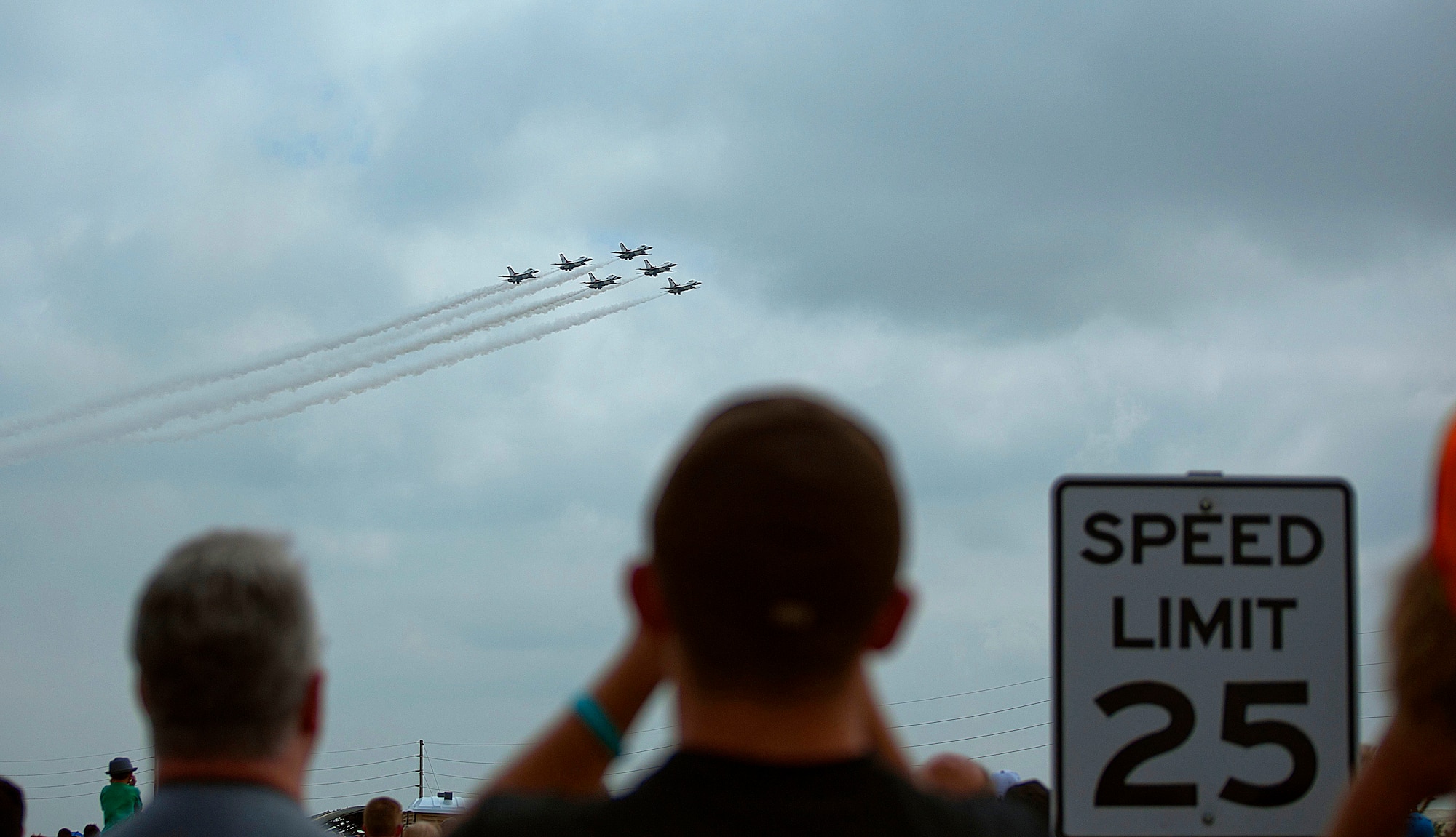 140723-F-GZ967-126 The U.S. Air Force Thunderbirds streak across the sky in a six-man formation July 23 during an air show during Cheyenne Frontier Days in Cheyenne, Wyo. The 25 miles per hour speed limit only applies to those on the ground. (U.S. Air Force photos by Airman 1st Class Brandon Valle)