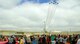 140723-F-BR137-069 The U.S. Air Force Thunderbirds fly over the Laramie county Community College grounds July 23 as a crowd of people watch. The Thunderbirds flew their 60th aerial demonstration in Cheyenne, Wyo., during Cheyenne Frontier Days. (U.S. Air Force photos by Airman 1st Class Jason Wiese)
