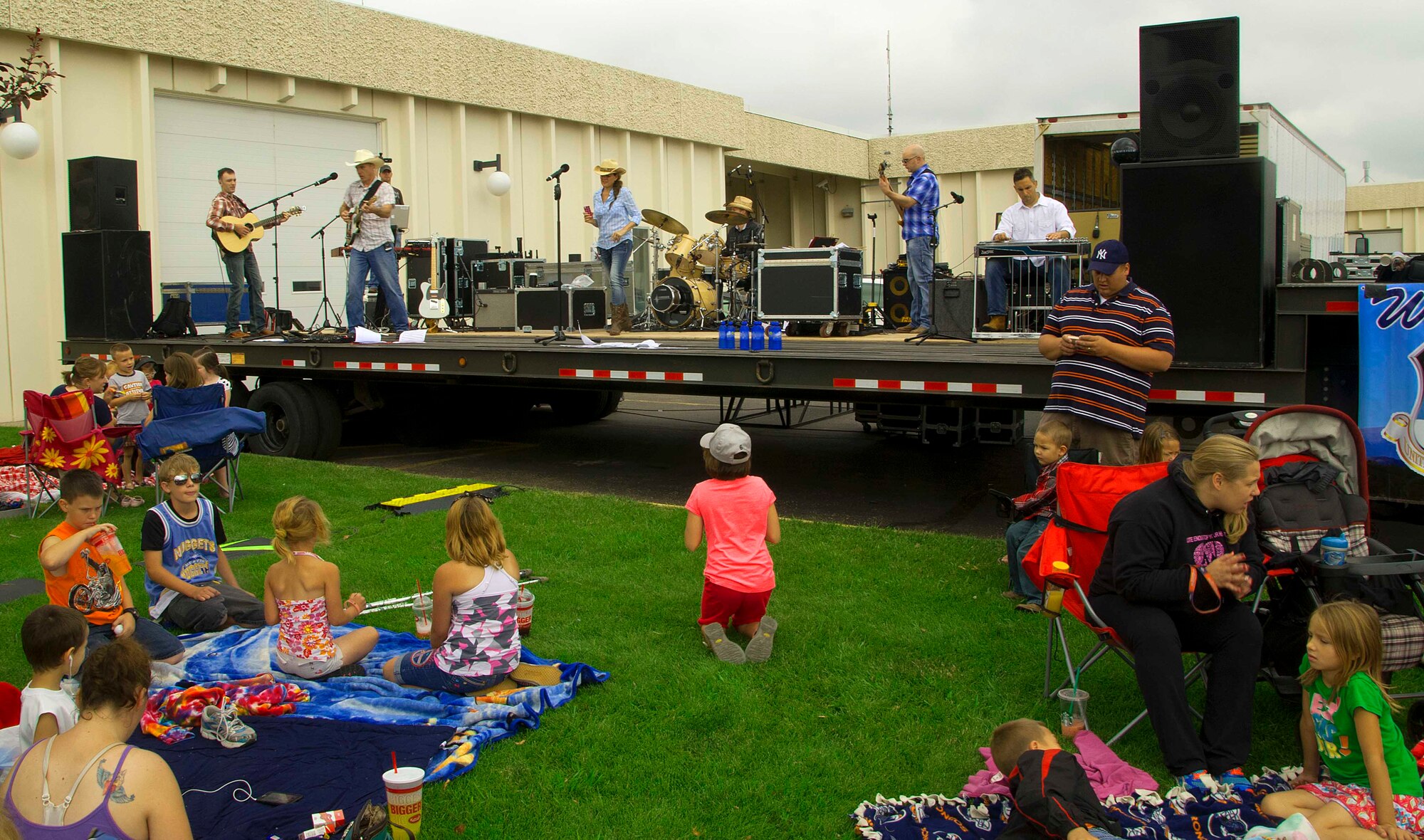 140723-F-BR137-062 A crowd of people watch as the U.S. Air Force Academy band, Wild Blue Country, performs on stage July 23 at Laramie County Community College. Wild Blue Country is an ensemble band made up of six full-time, active duty Air Force musicians. (U.S. Air Force photos by Airman 1st Class Jason Wiese)
