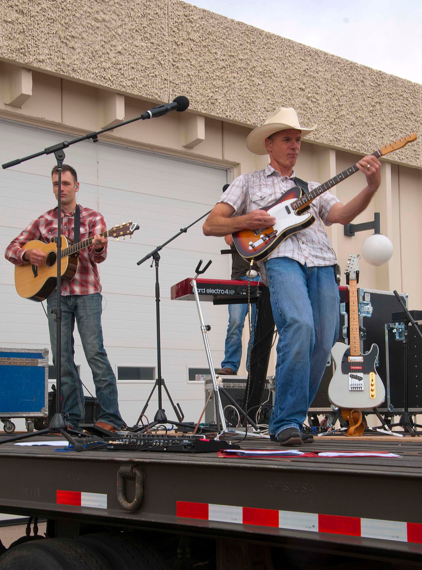 140723-F-BR137-043 Master Sgt. Stephan Brennen and Airman 1st Class Craig Larimer, musicians in the U.S. Air Force Academy band, Wild Blue Country, perform July 23 at Laramie County Community College. The band played as the opening act for the U.S. Air Force Thunderbirds air show. (U.S. Air Force photos by Airman 1st Class Jason Wiese)