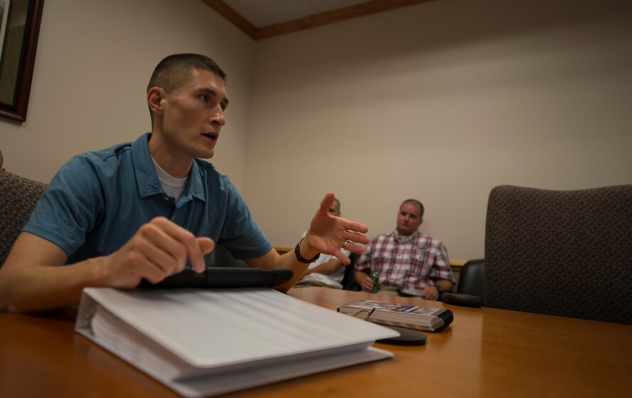 U.S. Air Force Maj. Jonathan Czarney, 23d Contracting Squadron commander, discusses how to set up a bare base during training at Moody Air Force Base, Ga., July 22, 2014. A bare base is a military base built from the ground up. (U.S. Air Force photo by Airman Dillian Bamman/Released)
