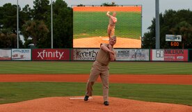 Master Chief Petty Officer Ronald Nagy, Naval Nuclear Propulsion Training Command command master chief, delivers the ceremonial first pitch during Military Appreciation Night July 19, 2014, at Joseph P. Riley Jr. ballpark in Charleston, S.C. The Charleston RiverDogs hosted Military Appreciation Night to show their support for the local military. (U.S. Air Force photo/ Staff Sgt. William A. O’Brien)